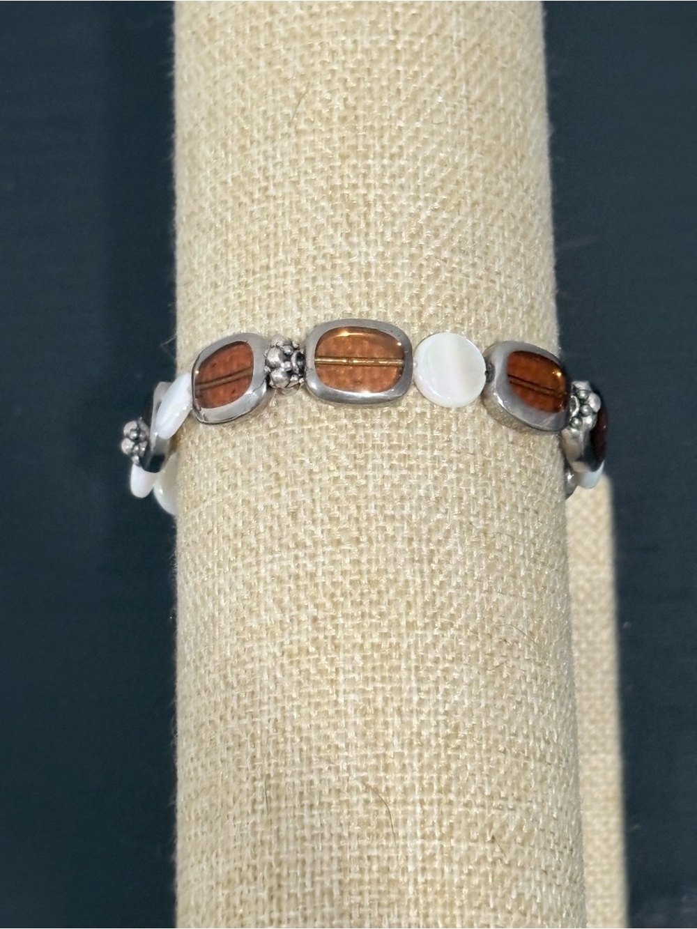 Handcrafted silver toned alternating brown and white oval beaded bracelet